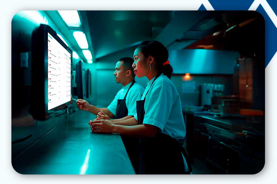 Team in the pantry following up on orders at the service assitant.